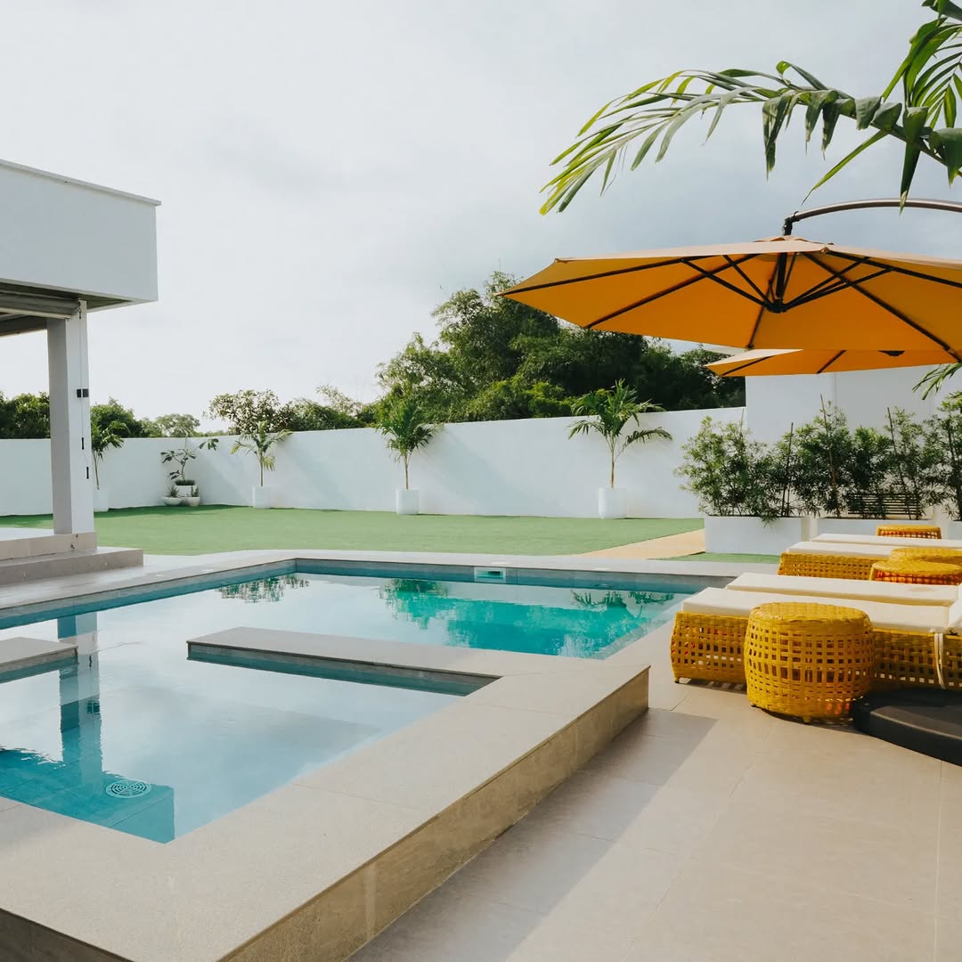 Open-air alfresco pavilion with pool view